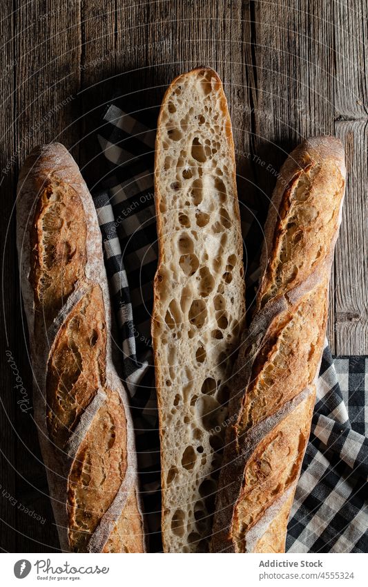 Sourdough baguettes located on table sourdough food baked tasty cut pastry crunch bakery crust pore half homemade cookery whole organic delicious product