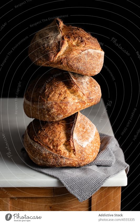 Baked sourdough bread placed on marble surface loaf food baked tasty pastry crunch bakery crust pore natural homemade cookery organic delicious flavor product