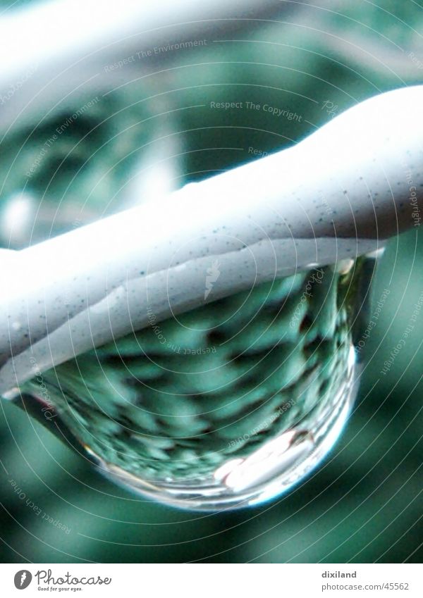 A drop of tablecloth Reflection Living or residing Drops of water Water Rain Macro (Extreme close-up) Tablecloth