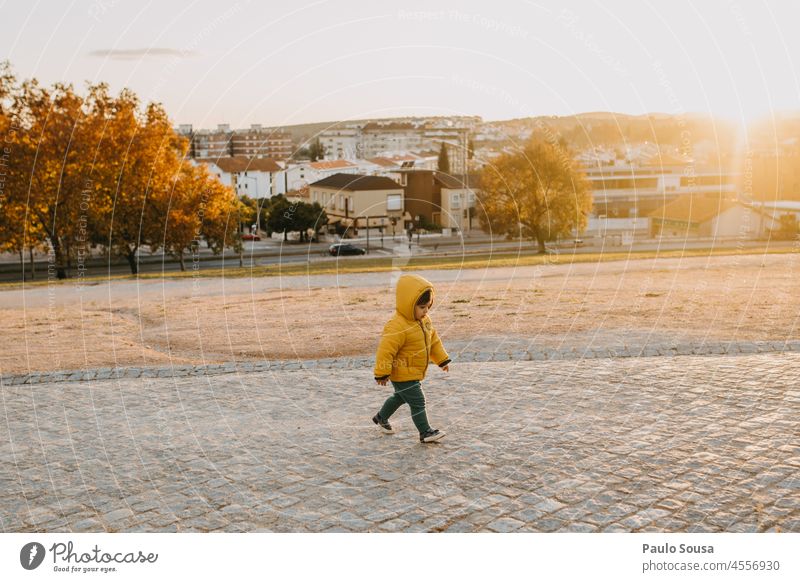 Child with Yellow hooded jacket childhood Boy (child) Hooded (clothing) Hooded jacket Authentic Human being Autumn Leisure and hobbies Nature 1 - 3 years