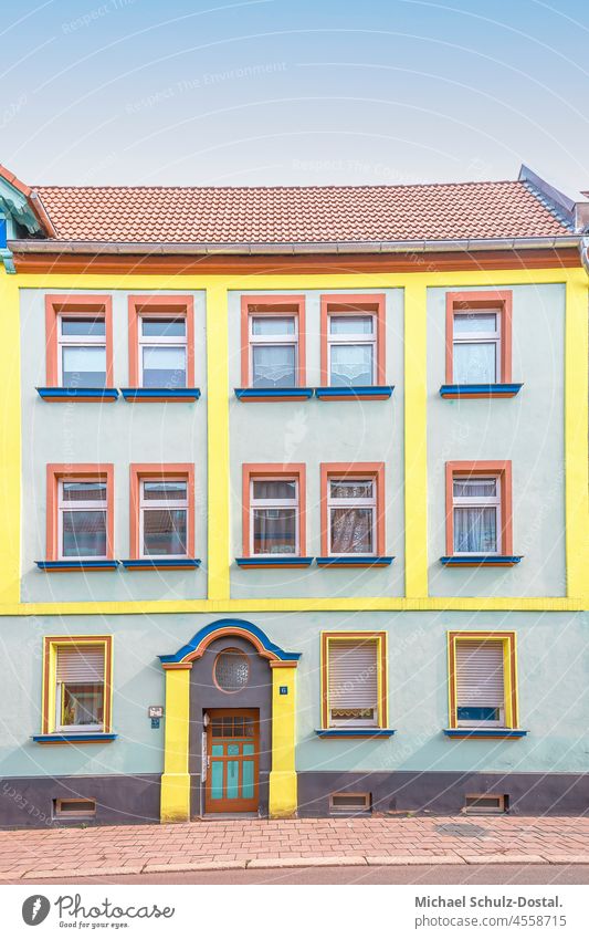 Grey-yellow tenement house of the Magdeburg modern age Architecture Colour photo Modern architecture minimal pastel Window Deserted