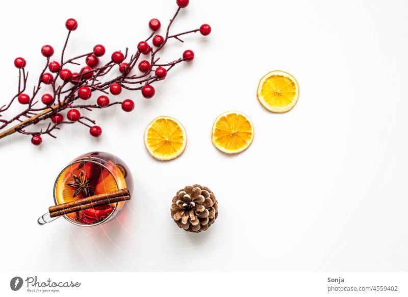 Mulled wine and spices in a drinking glass and dried orange slices. Still life from above. Orange seasoning Hot drink Christmas & Advent Tradition Colour photo