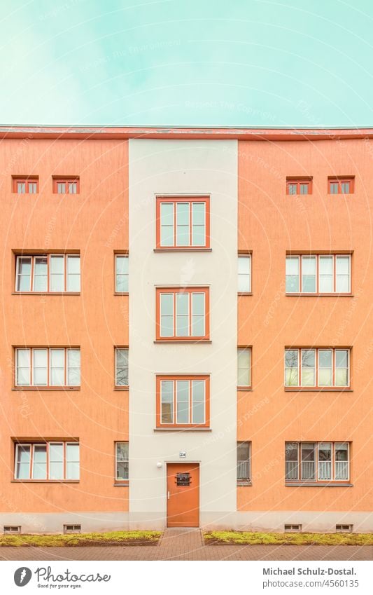 Bauhaus block in orange with red door Green Lawn Deserted Manmade structures House (Residential Structure) Colour photo Modern architecture Magdeburg Modernity