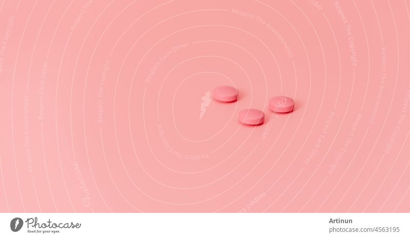 Old rose round tablet pills on old rose background. Pharmaceutical industry. Healthcare and medicine. Prescription drug. Online pharmacy banner. New drug research and development concept. Sample drug.