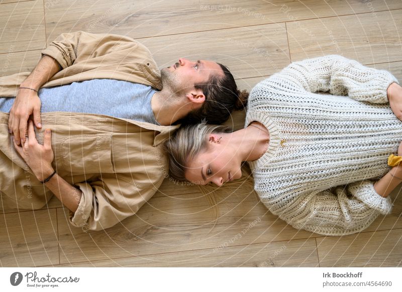 2 people from above turned away from each other on the ground Lie Human being good-looking prostrate real people view from above young love Bird's-eye view