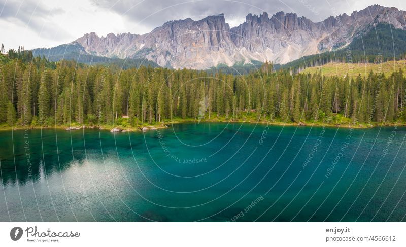Karersee shortly before the rain karersee South Tyrol Italy Dolomites Mountain latemar Forest Lake mountain lake Turquoise Water Clouds Alps Vacation & Travel