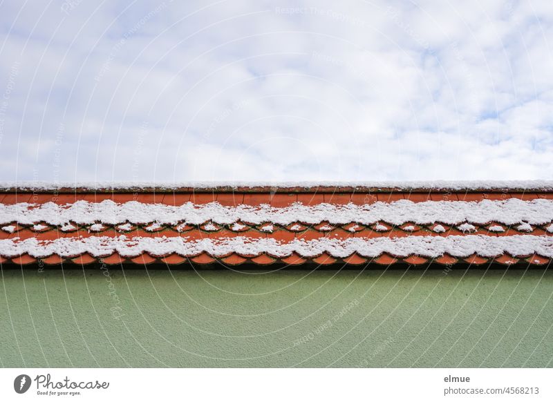 light snowy narrow red tiled roof, green house wall and blue sky with white clouds / winter Tiled roof Roofing tile Snow Green Colour Sky blue Clouds