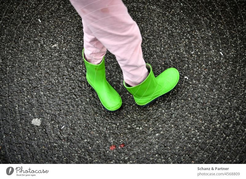 green rubber boots on knotted legs Rubber boots Child Playing Pink Legs Pants Turn back Distorted feet Footwear Boots Wet
