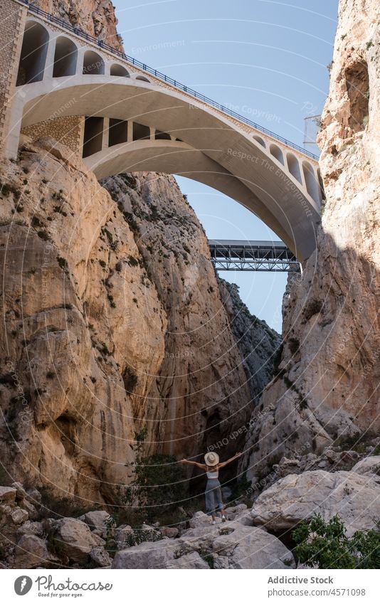 Woman standing under bridges in Calpe woman travel nature construction aged journey mountain rock trip shabby stone arched rocky old spain calpe mascarat