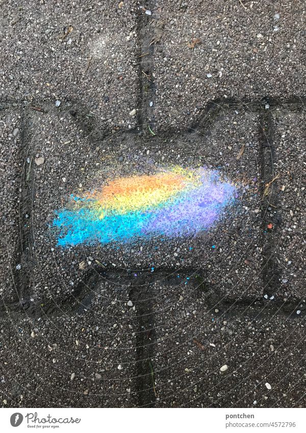Washed-out sidewalk chalk on wet cobblestones. street chalk Wet Rain luminous colours cheerful Children's game variegated Paving stone blurred Creativity