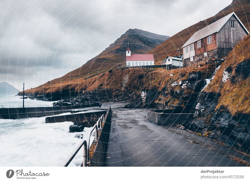 Faroe Islands: View of road, Hausl harbour and church Territory Slope curt Dismissive cold season Denmark Experiencing nature Adventure Majestic Curiosity