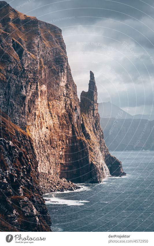 Faroe Islands: View of the "Witches Finger" in the sunlight Territory Slope curt Dismissive cold season Denmark Experiencing nature Adventure Majestic Curiosity