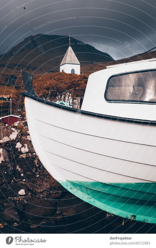 Faroe Islands: View of boat, church and mountains Territory Slope curt Dismissive cold season Denmark Experiencing nature Adventure Majestic Curiosity