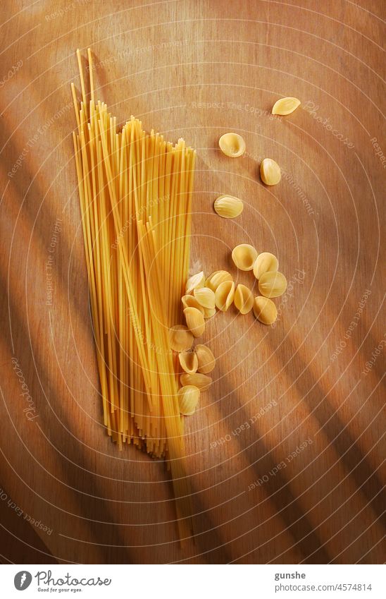 Raw pasta ready for cooking food raw italian ingredient macaroni meal wheat uncooked healthy dry cuisine traditional nutrition yellow italy spaghetti farfalle
