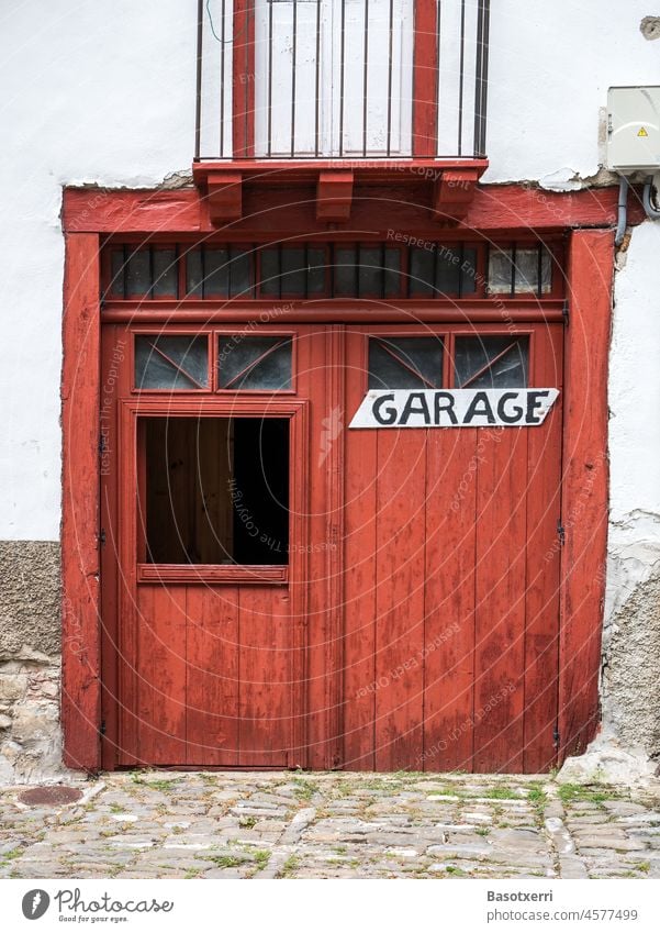 Old white building with red gate and the inscription "Garage". House (Residential Structure) Building Red Facade Goal Wall (building) White Colour photo door