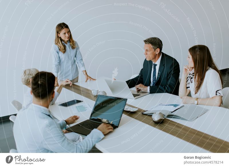 Young business partner explaining project details on a meeting in office brainstorming business meeting business team businessman businesswoman colleagues