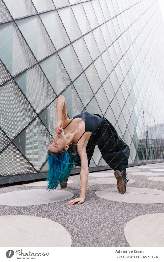 Female dancing contemporary on street woman dance perform urban city dancer move motion female style energy modern building exterior action hobby lady activity