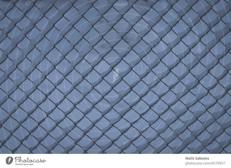snow covered wire fence as a background abstract barrier blue border cage chain closeup cold decorative design detail frost frosty grid iron link mesh metal