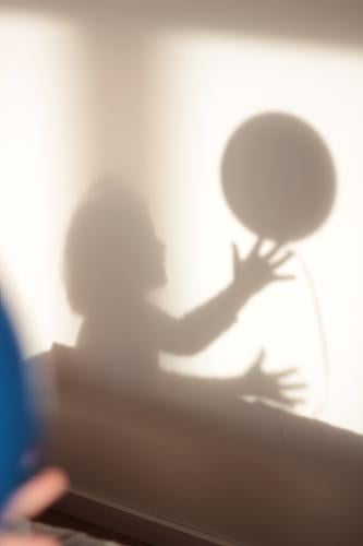 Shadow play child playing with ball shilouette Ball Effortless Playing playing child Dark side Shadow child Shadowy existence Gray Child hands Catch catching