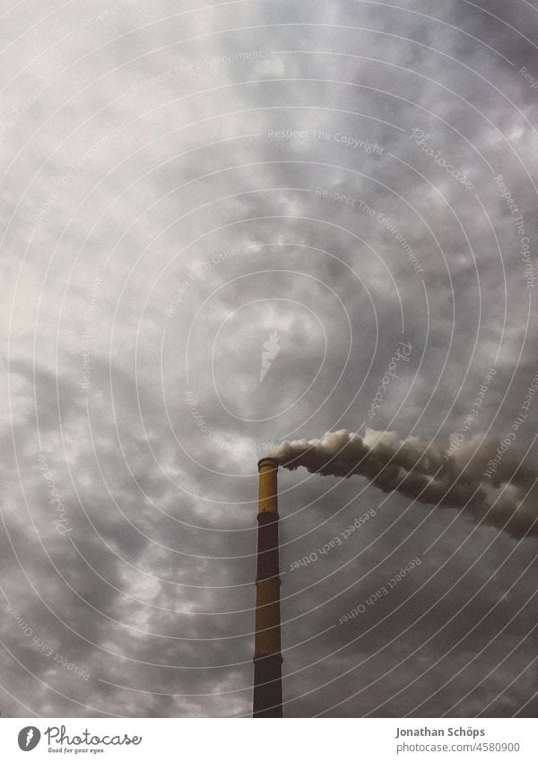 gloomy cloudy sky behind smoking forge in Chemnitz CO2 emission Coal power station Energy industry Clouds Heating power station north Threat Fear Dirty