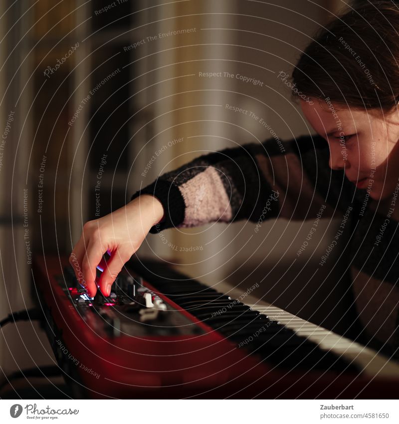 Girl playing red keyboard at night, hand on controller Hand hands Keyboard songwriting fumble Red Buttons Controller Music Playing play music Musical instrument