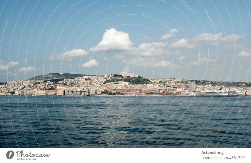 View of Naples Town Ocean Summer vacation Far-off places Hill Horizon Building Water Waves Sky Clouds Blue Campania Gulf of Napels coast Colour photo Landscape
