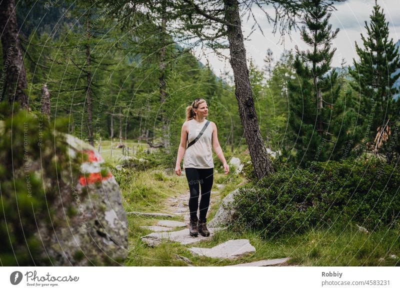 young woman hiking in dabaklamm in austria Hiking stroll hiking trail Young woman Blonde Movement Austria Dabaklamm Eastern Tyrol Hohe Tauern National Park