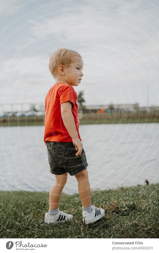 Little boy with style walking beside a pond with ducks Toddler Cute Style Childhood spring fun Travel Adventure Ducks Little kid style Little boy style Fashion