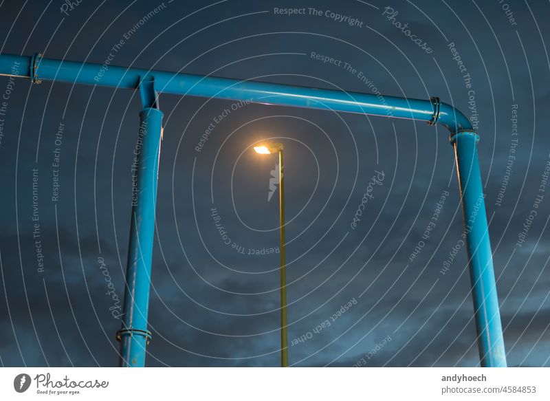 Gate from a water pipe with a street light abstract aqua blue city clean clear cloud scape construction construction site copy space dark design drain energy