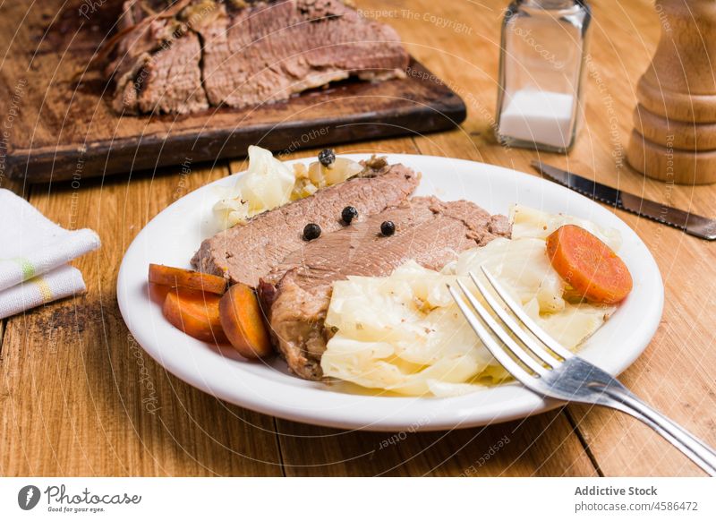 Delicious corned beef with cabbages and carrot served on plate delicious vegetable meat tasty dish food wooden meal gourmet cuisine homemade nutrition piece