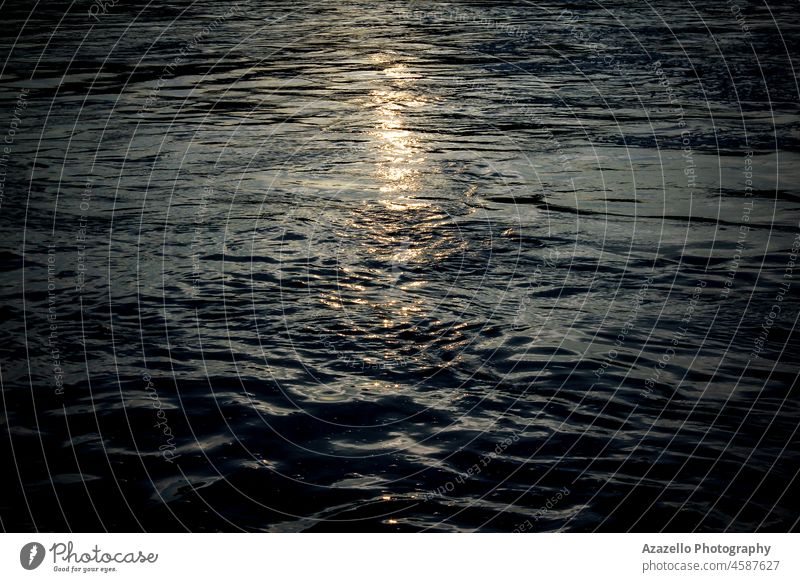 Beautiful sunlight reflections on water surface during sunset. mystery meditation mood night moonlight twilight abstract environment nature beauty backdrop