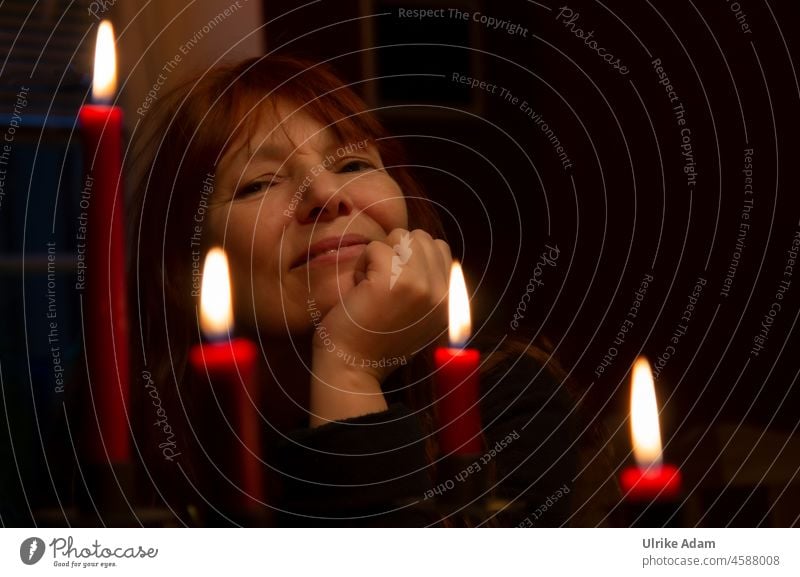 Merry Christmas - Portrait of a woman, with four candles in the foreground Congenial Happiness Open Sincere Forward Without makeup naturally Happy Contentment