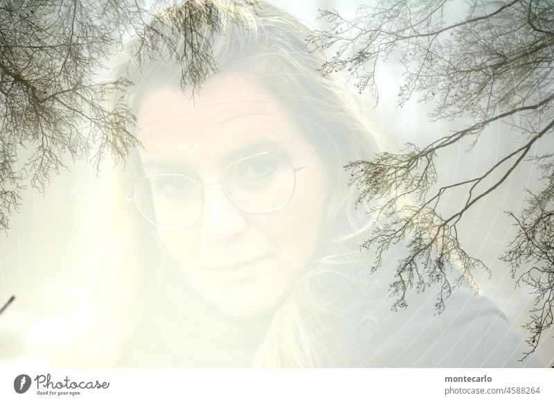 The beauty in the eye of the beholder | Face Double exposure Woman Nature Forest Fusion portrait topic day Weather surreal Light Eyeglasses Looking Delicate