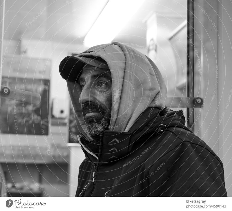 Young man freezing at the window Masculine 18 - 30 years Man Human being Exterior shot Black & white photo Shallow depth of field Facial hair portrait