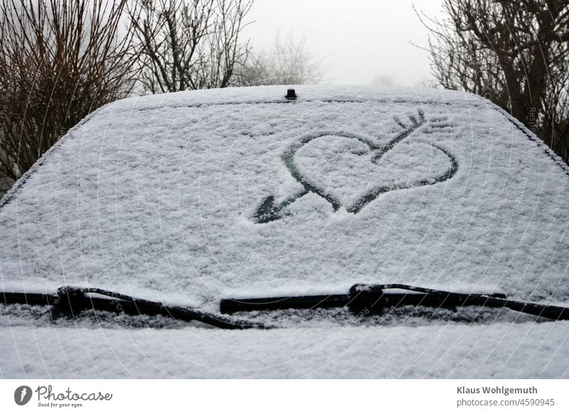 Heart with arrow drawn in the snow on a car window Heart-shaped heart with arrow Snow Drawing Arrow FRontwheel Car Window Winter Pictogram Love Emotions