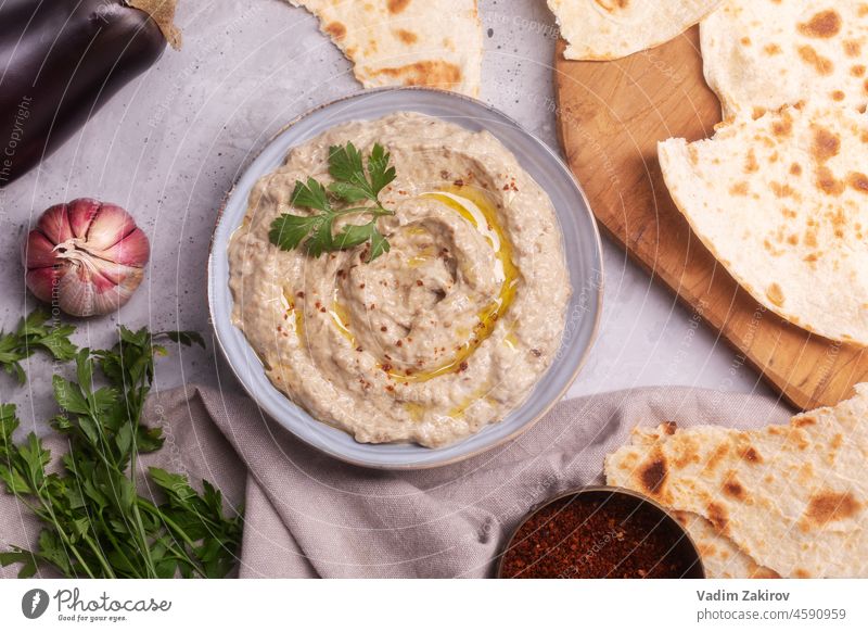 Baba ganoush, Ezme of oriental, Levantine cuisine with lavash and herbs made from baked eggplant with sesame paste, top view appetizer arabic cuisine aubergine