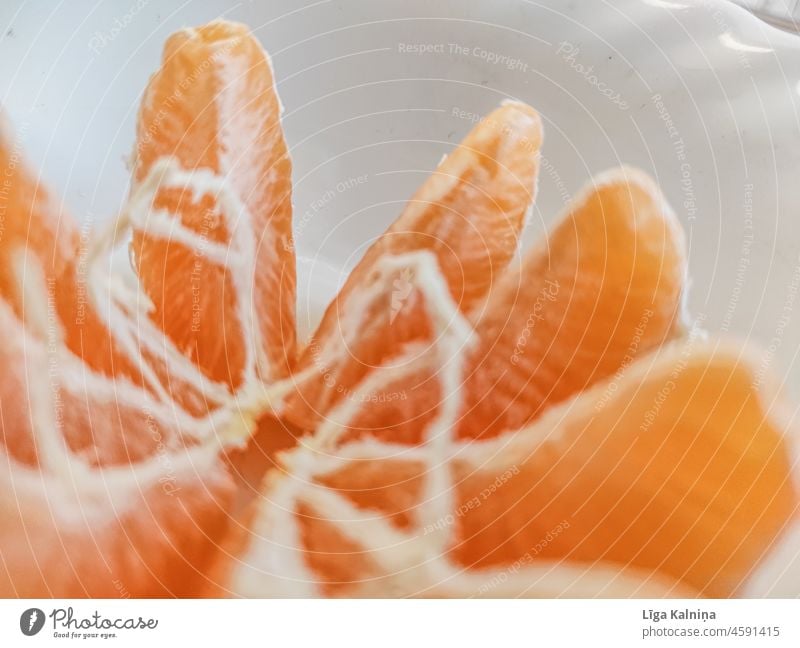 Peeled and opened tangerine or Clementine clementine citrus fruit Orange food Fruit healthy Food Fresh organic sweet Colour photo Tangerine orange vegetarian