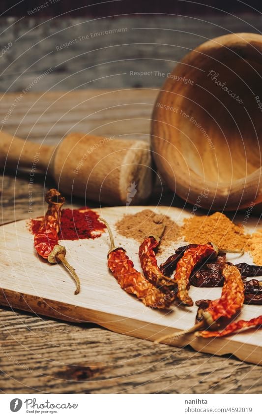 Still life of exotic and hot spices spicy indian arabic tumeric ginger powder pepper chilly ingredient garlic nutmeg cayenne tasty art artistic rustic rural