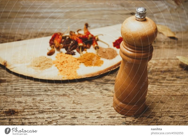 Still life of exotic and hot spices spicy indian arabic tumeric ginger powder pepper chilly ingredient garlic nutmeg cayenne tasty art artistic rustic rural