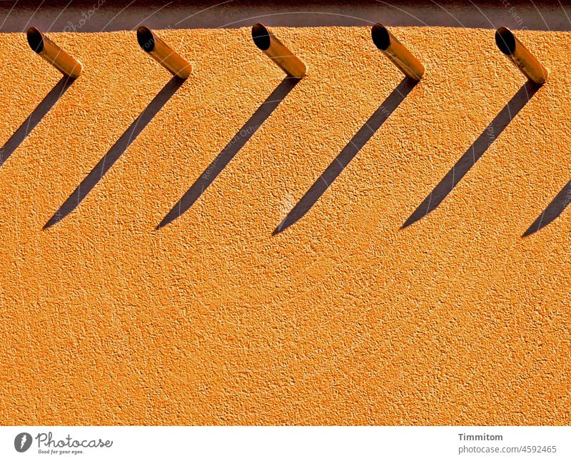 Partial view facade - orange Facade Orange Building Plaster reeds Metal Light Shadow Sunlight Deserted Architecture Colour photo lines partial view