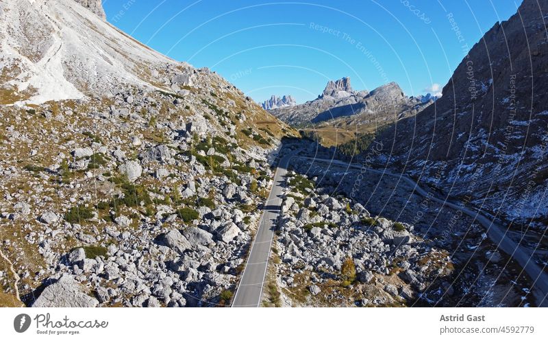 Aerial view with a drone from the Valparola Pass in South Tyrol, Italy Aerial photograph drone photo Street mountain valparola pass Dolomites Landscape