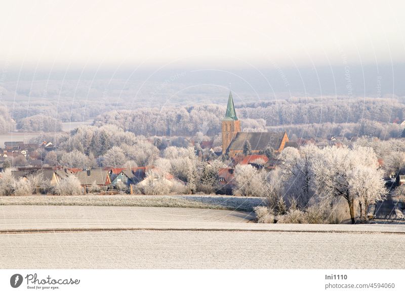 Winter dream hoarfrost on fields, trees and roofs, view of church in village Season Winter mood Winter magic Frost Village Hoar frost houses Church Church spire