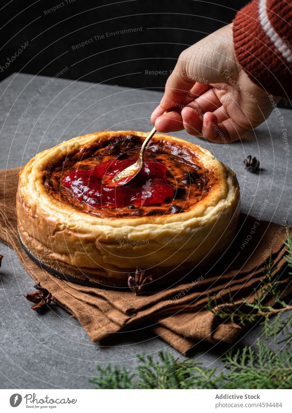 Cher serving delicious cheesecake with jam chef dessert serve yummy sweet homemade food jar tasty appetizing cuisine pastry meal fresh table bakery portion