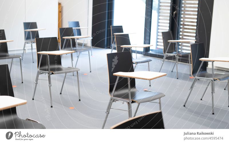 Chairs spaced in a school as a protective measure against Covid 19 covid-19 pandemic coronavirus Corona virus Healthy prevention Risk of infection Protection