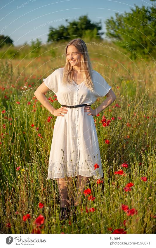 cheerful young woman standing in poppy field Woman Poppy Laughter sensual daintily Young woman Poppy field pretty Meadow Stand Flower meadow fortunate time-out