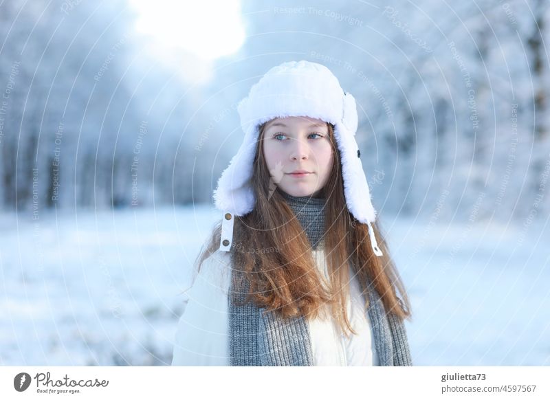 Winter portrait of long haired teenage girl with Russian ushanka cap in snowy park Youth (Young adults) Long-haired 13 - 18 years Young woman Girl Feminine