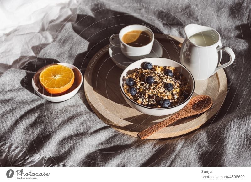 Breakfast in bed with cereal, fruit and milk on a serving tray Cereal bowl Coffee Bed Milk Orange Healthy Eating Colour photo Bedclothes White at home hygge