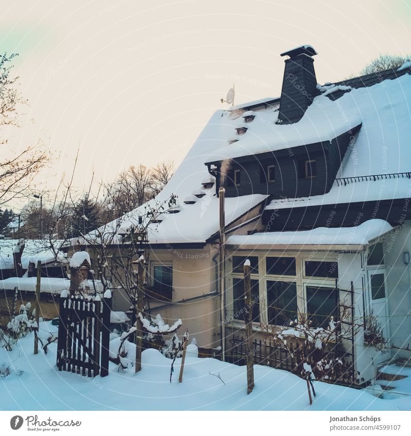 Family house in winter with snow and chimney Detached house Winter Snow Chimney Smoke Heat heating costs Heating Idyll Winter mood Cold
