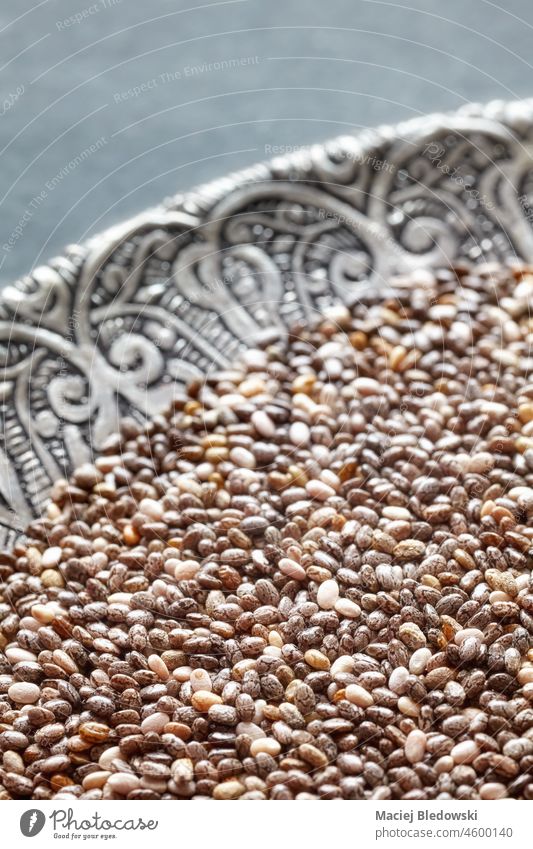 Close up picture of chia seeds on a plate, selective focus. edible food superfood Salvia hispanica healthy close up macro raw vegetarian organic ingredient