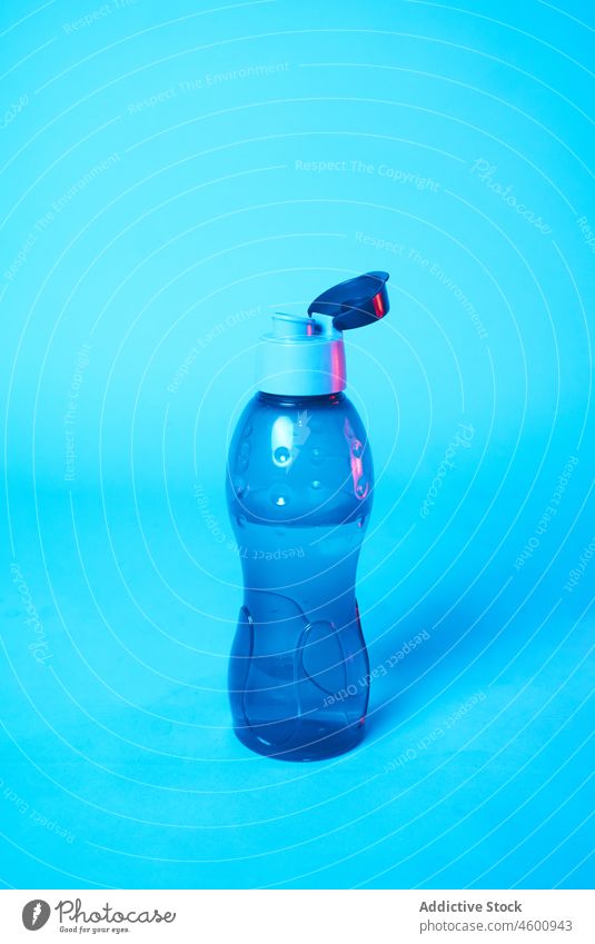 Bottle of water on blue background bottle studio plastic refreshment open aqua liquid colorful healthy lifestyle transparent thirst active container clear lid